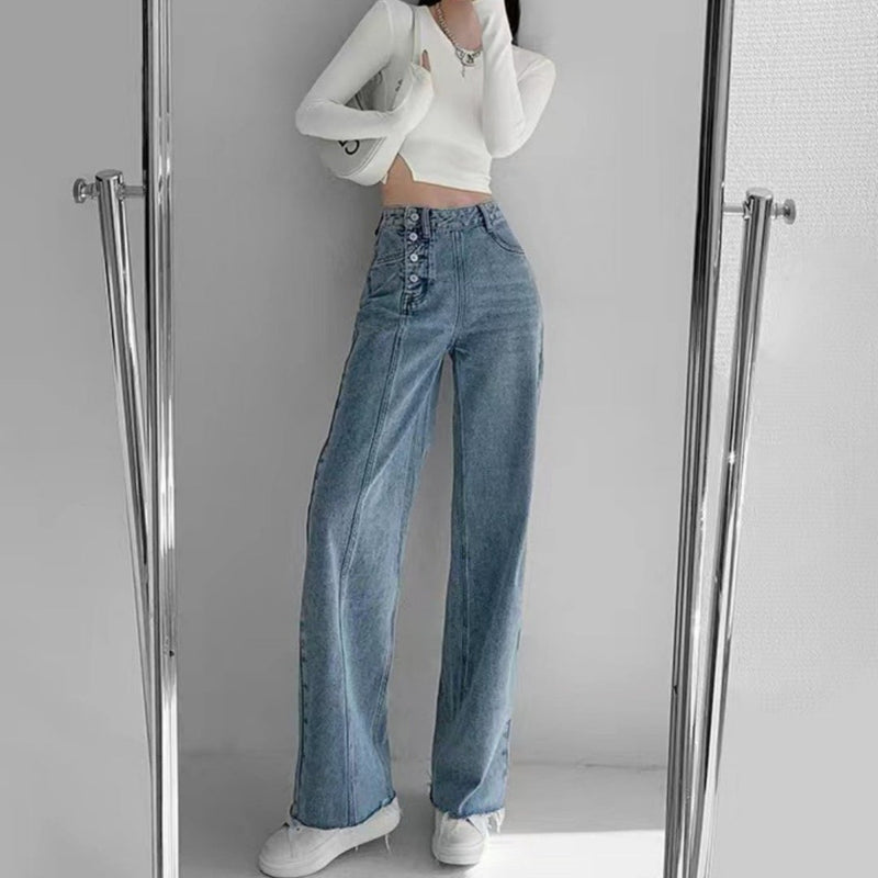 Spacewallart irregular breasted high waist jeans featuring a unique design, denim fabric, and a fitted high-rise silhouette.