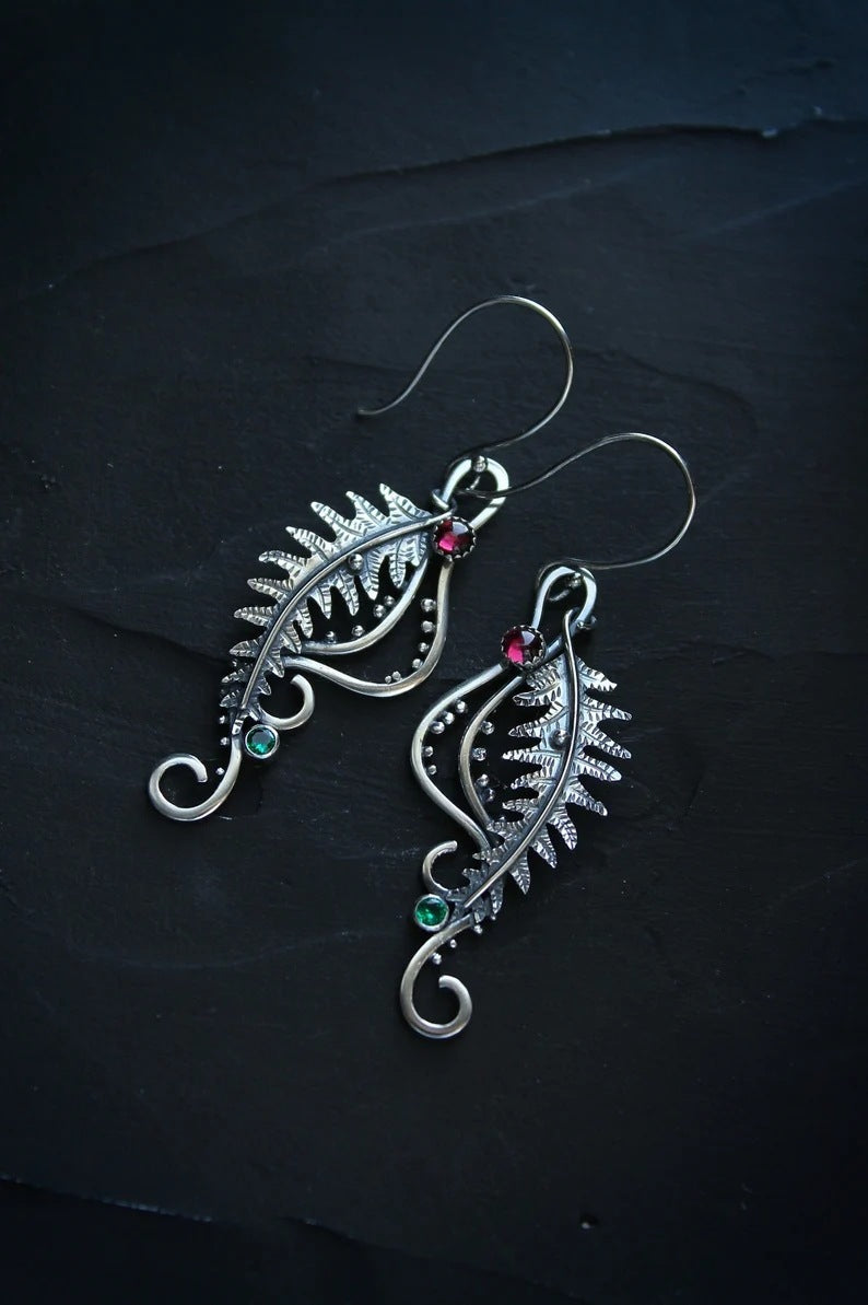 Spacewallart tail shape earrings with sleek, curved design, showcasing modern jewelry accessories for stylish ear adornment.