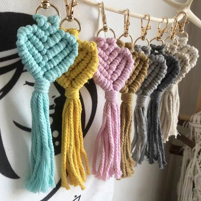 Hand-woven key accessory by Spacewallart, small creative gift, made for apparel, featuring intricate woven design on a keychain.