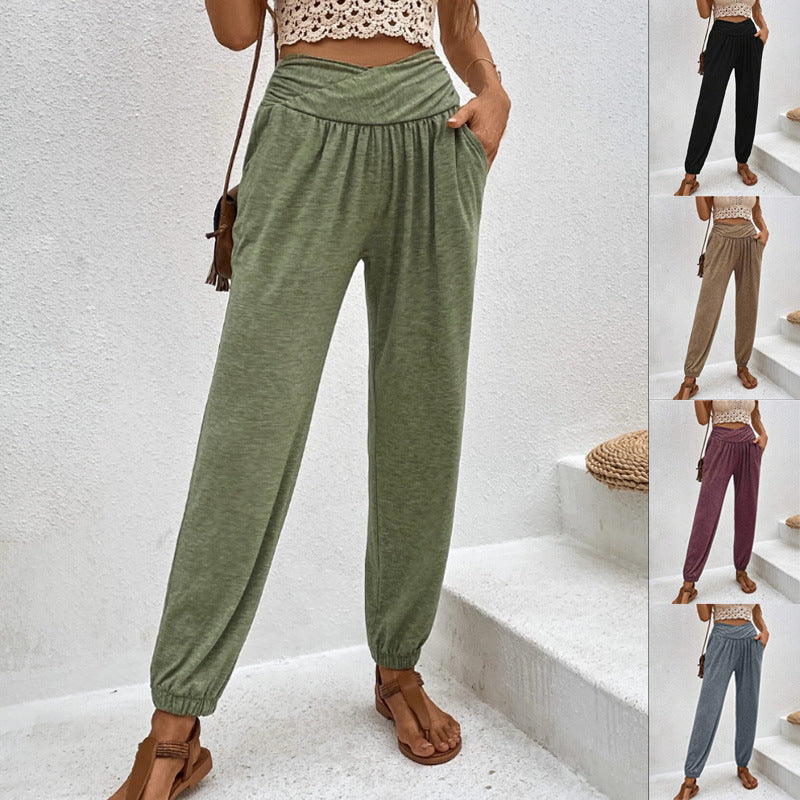 Casual loose-fit ankle-tied trousers with pockets from Spacewallart, shown in a relaxed fit with a tie at the ankle.