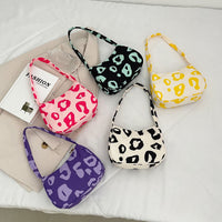 Korean street trend hand-carried bag by Spacewallart, stylish accessories with a modern design, shown in a close-up image.