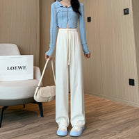 Spacewallart Makaron knitted wide-leg pants, stylish beige apparel with a relaxed fit, displayed on a model.