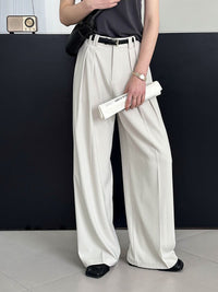 Loose retro casual pants from Spacewallart featuring a relaxed fit and vintage-inspired design, displayed on a hanger.