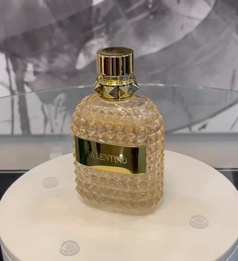 Valentino Uomo Born In Roma The Gold Eau de Toilette for Men in 3.4 oz bottle, sealed, with sleek gold packaging and branding.