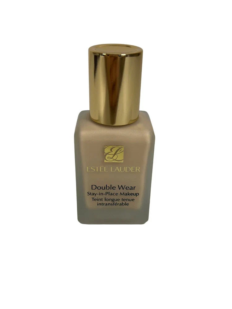 Estée Lauder Double Wear Stay-in-Place Foundation shade 1W1 Bone, 1 oz bottle with pump dispenser, in a sleek glass bottle.