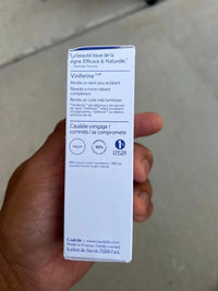 Caudalie Vinoperfect Brightening Dark Spot Serum bottle, 1 oz, with sleek packaging and a dropper for skincare application