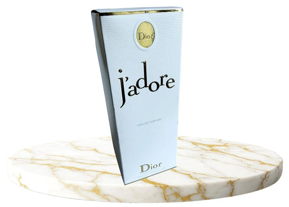 Christian Dior J'adore Eau de Parfum for Women in 3.4 oz bottle, elegant glass fragrance bottle with gold accents.