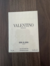 Valentino Donna Born In Roma Ivory Eau de Parfum for Women, 3.4 oz, elegant perfume bottle with gold accents and white cap