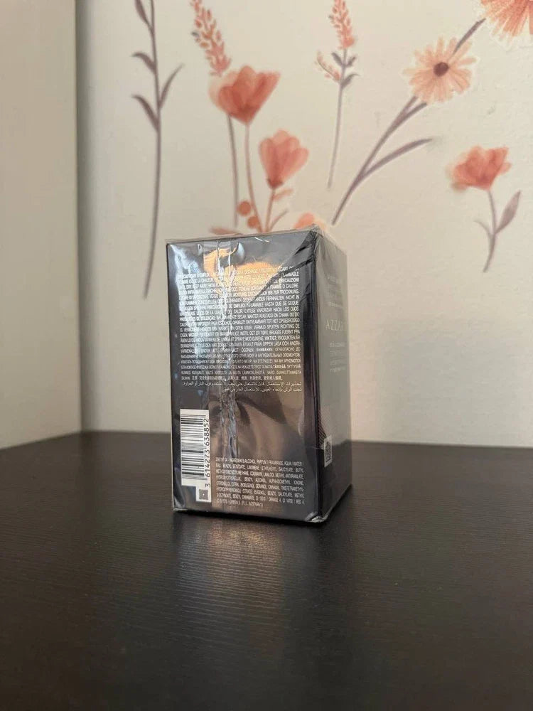 Azzaro The Most Wanted men's parfum spray bottle with a sleek design, pictured with a black cap and modern label.