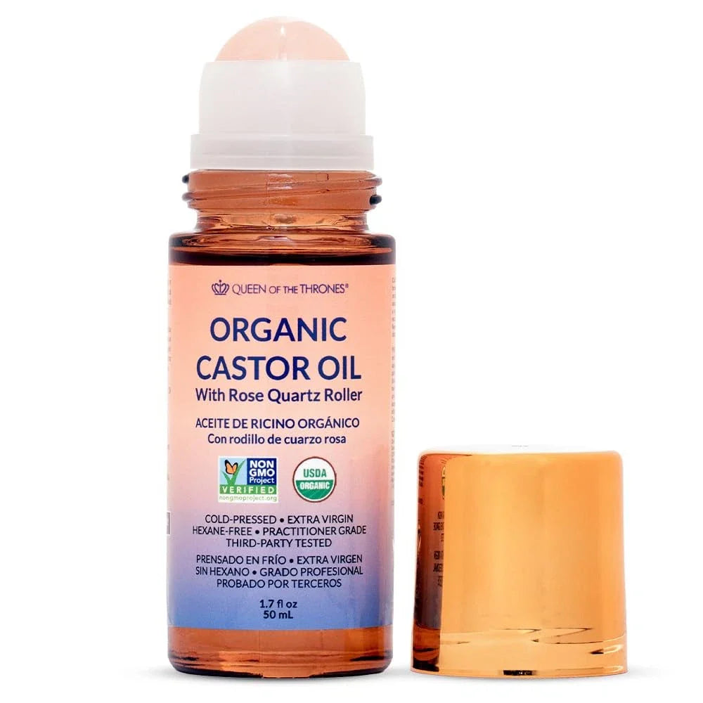Spacewallart Queen of the Thrones Organic Golden Castor Oil Roll-On with Rose Quartz, 50ml, in a clear glass bottle with a roller applicator.