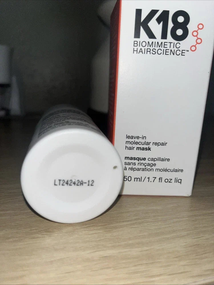 K18 Leave-In Molecular Repair Hair Mask in 1.7 fl oz bottle, featuring sleek packaging and branding for damaged or processed hair.