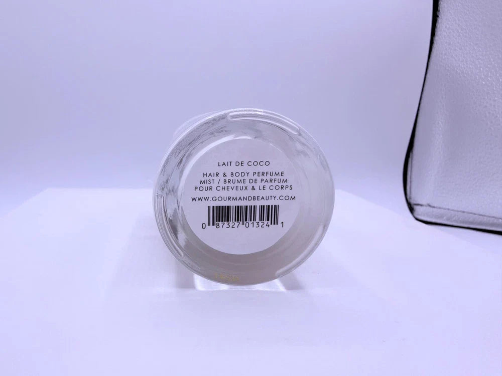 Spacewallart Le Monde Gourmand Lait de Coco Eau de Toilette 3.4 oz bottle with coconut-themed packaging and elegant branding.