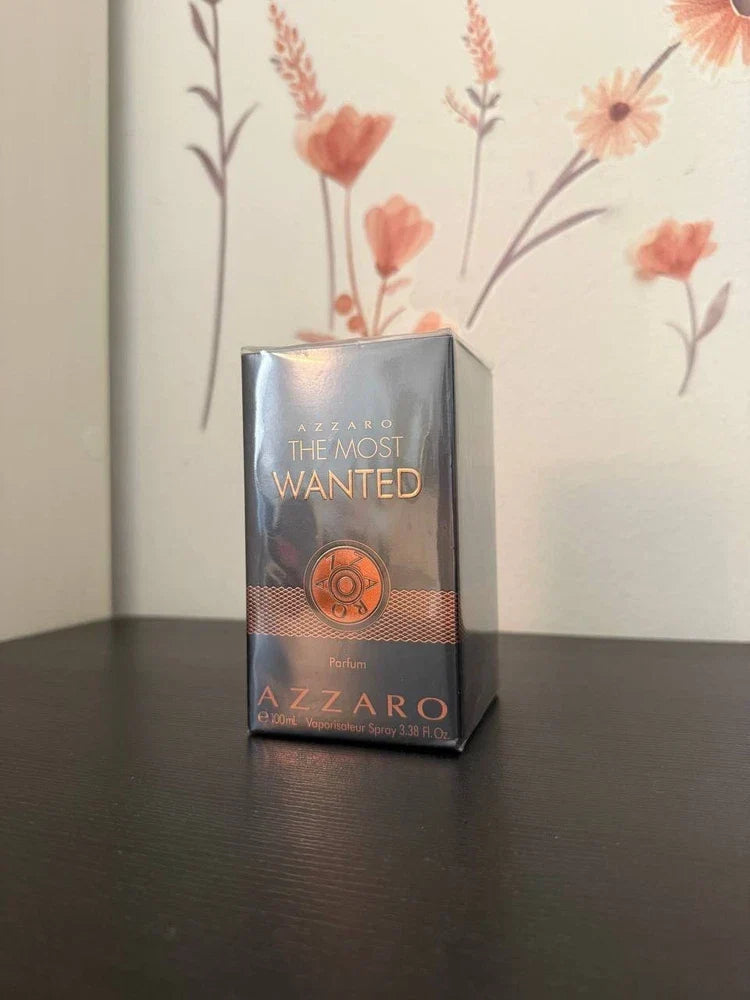 Azzaro The Most Wanted men's parfum spray bottle with sleek black design and silver accents, 3.38 oz (100 ml).
