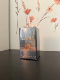 Azzaro The Most Wanted men's parfum spray bottle with sleek black design and silver accents, 3.38 oz (100 ml).