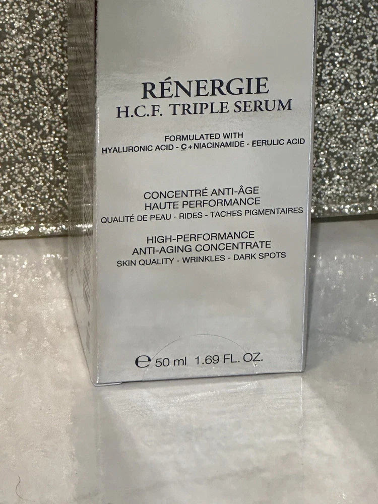 Lancôme Rénergie H.C.F. Triple Serum anti-aging face serum in sealed bottle, designed for skin rejuvenation and hydration.