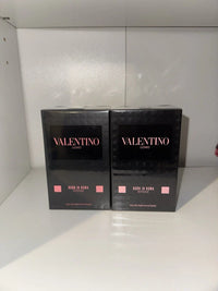 Valentino Uomo Born In Roma Coral Fantasy Eau de Toilette for men in 3.4 oz bottle, featuring a coral-colored fragrance bottle.