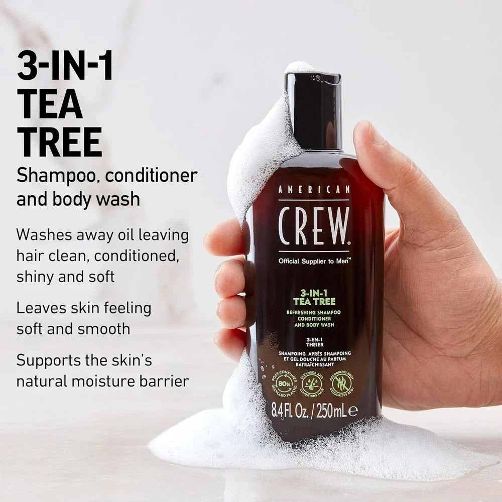 American Crew 3-in-1 Tea Tree Shampoo, Conditioner & Body Wash bottle, 33.8 fl oz, with green tea tree label and pump dispenser.