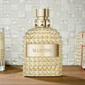 Valentino Uomo Born In Roma The Gold Eau de Toilette for men in a 3.4 oz bottle, sealed, with elegant gold packaging.
