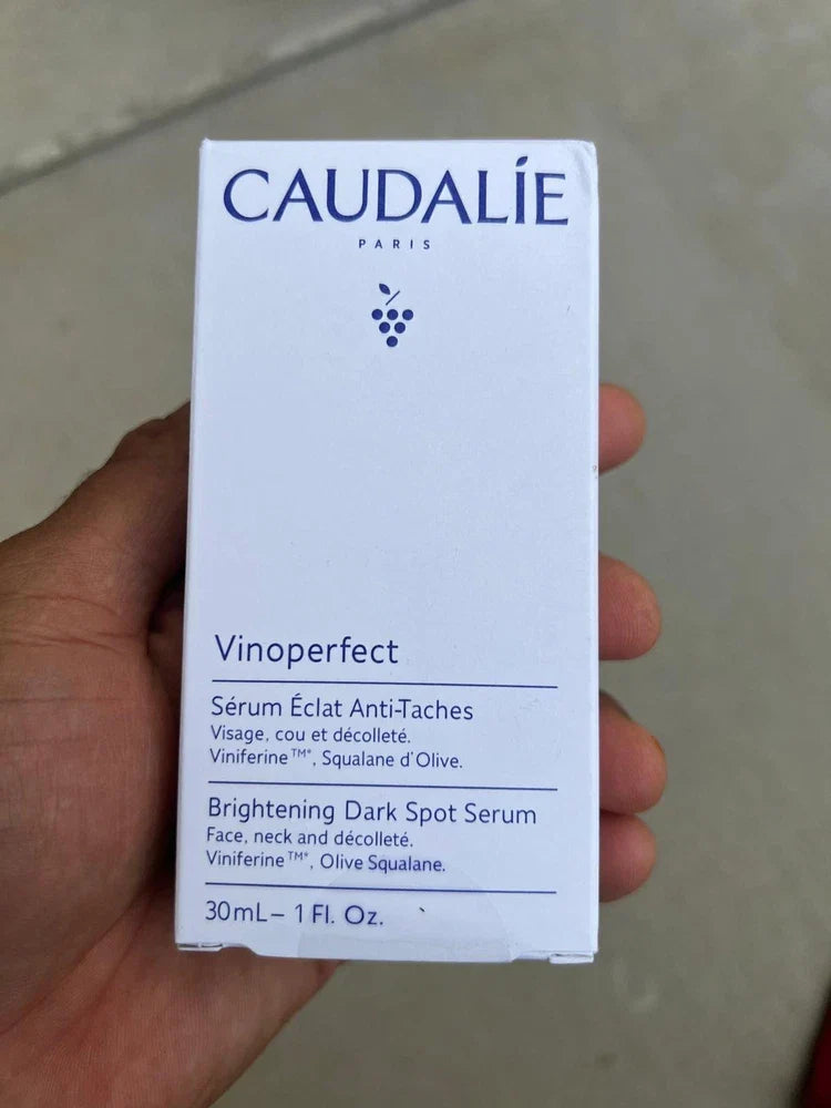 Caudalie Vinoperfect Brightening Dark Spot Serum in 1 oz bottle, featuring a sleek glass container and dropper applicator for skincare.