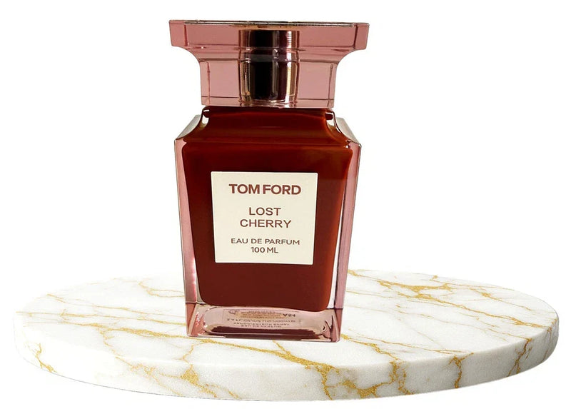 Tom Ford Lost Cherry Eau de Parfum bottle from Spacewallart, 3.4 oz, featuring a sleek design and red accents.