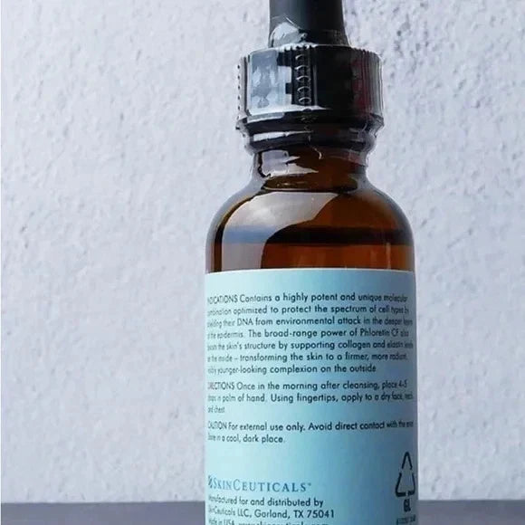 SkinCeuticals Phloretin CF Vitamin C antioxidant face serum in a sealed 1 fl oz/30ml bottle, displayed on a white background.