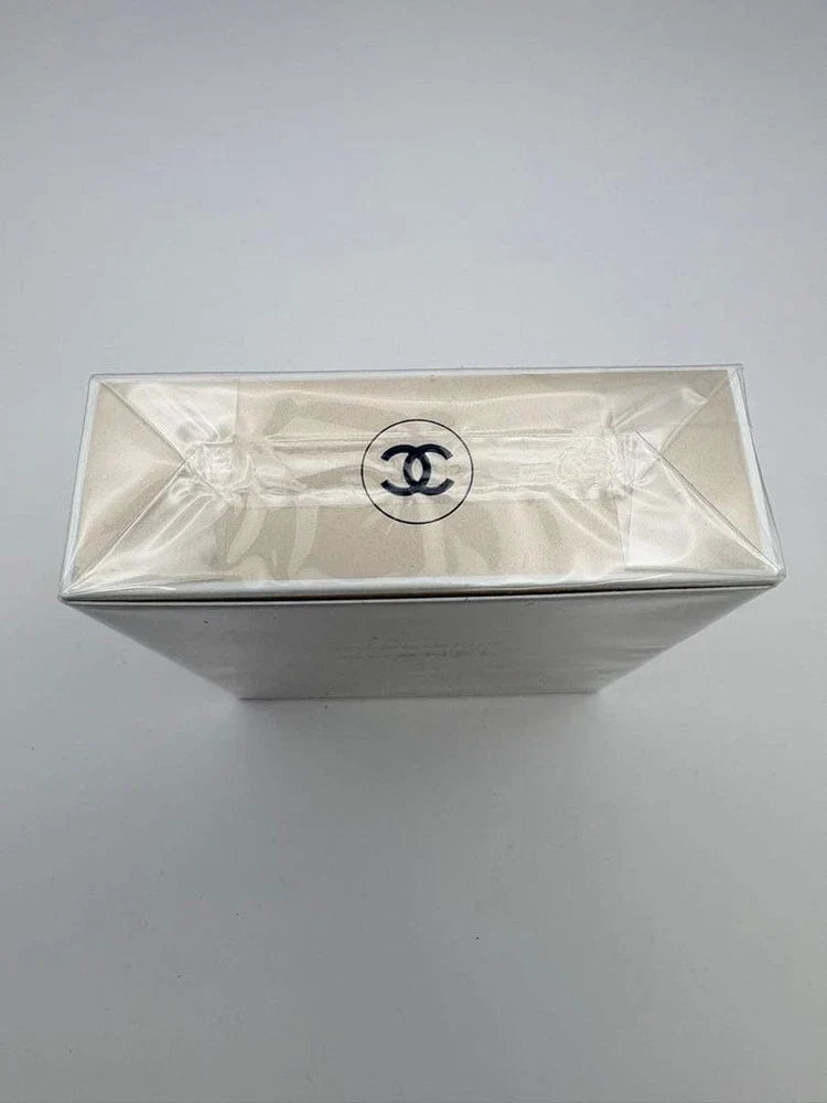 Chanel Gabrielle Eau de Parfum for Women in 3.4 oz bottle, elegant glass perfume bottle with a gold cap and floral design.