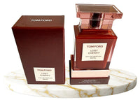 Tom Ford Lost Cherry Eau de Parfum unisex bottle with a sleek black design, 3.4 oz (100 ml), on a stylish background.