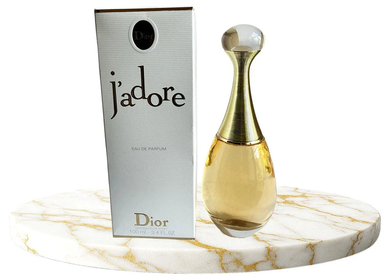 Christian Dior J'adore Eau de Parfum bottle for women, 3.4 oz, with elegant transparent glass and gold accents.