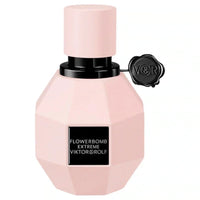 Viktor & Rolf Flowerbomb Extreme Eau de Parfum for women in a clear glass bottle with floral design, displayed on a white background.