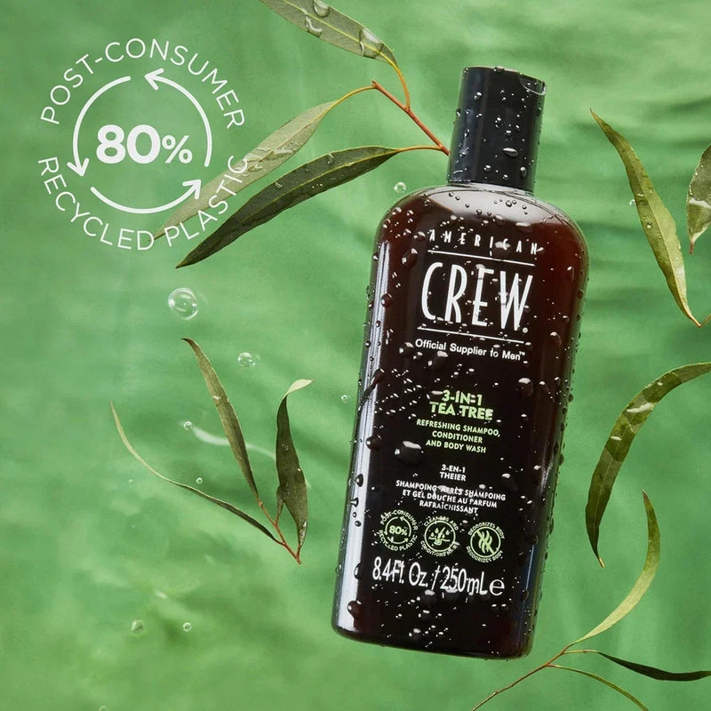 American Crew 3-in-1 Tea Tree Shampoo, Conditioner & Body Wash bottle, 33.8 fl oz, with green label and pump dispenser.