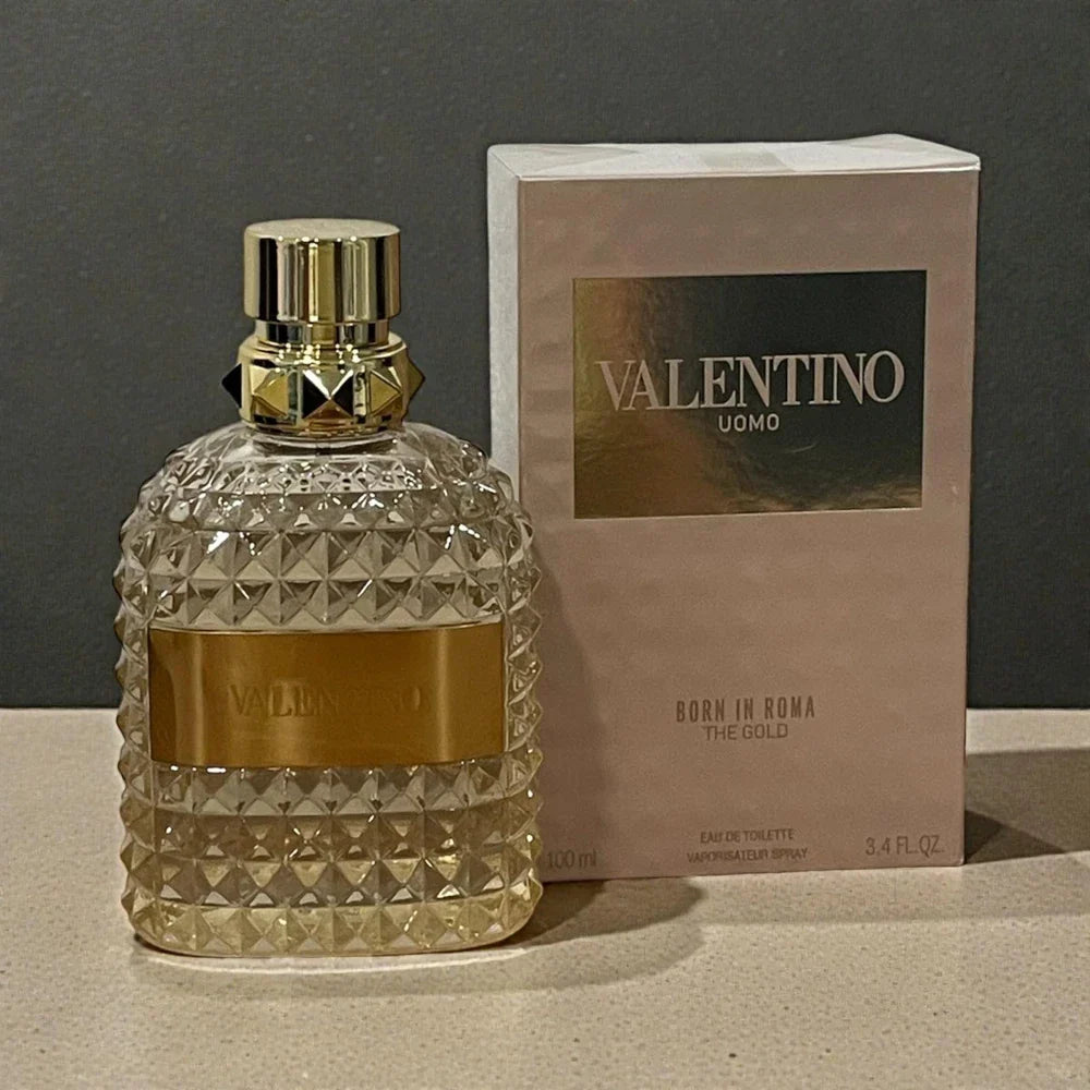 Valentino Uomo Born In Roma The Gold Eau de Toilette for Men in 3.4 oz bottle, sealed, with gold-colored packaging and branding.
