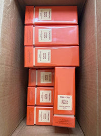 Tom Ford Bitter Peach Eau de Parfum bottle, 1.7 oz and 3.4 oz, sealed and authentic, with a sleek glass design and orange accents.